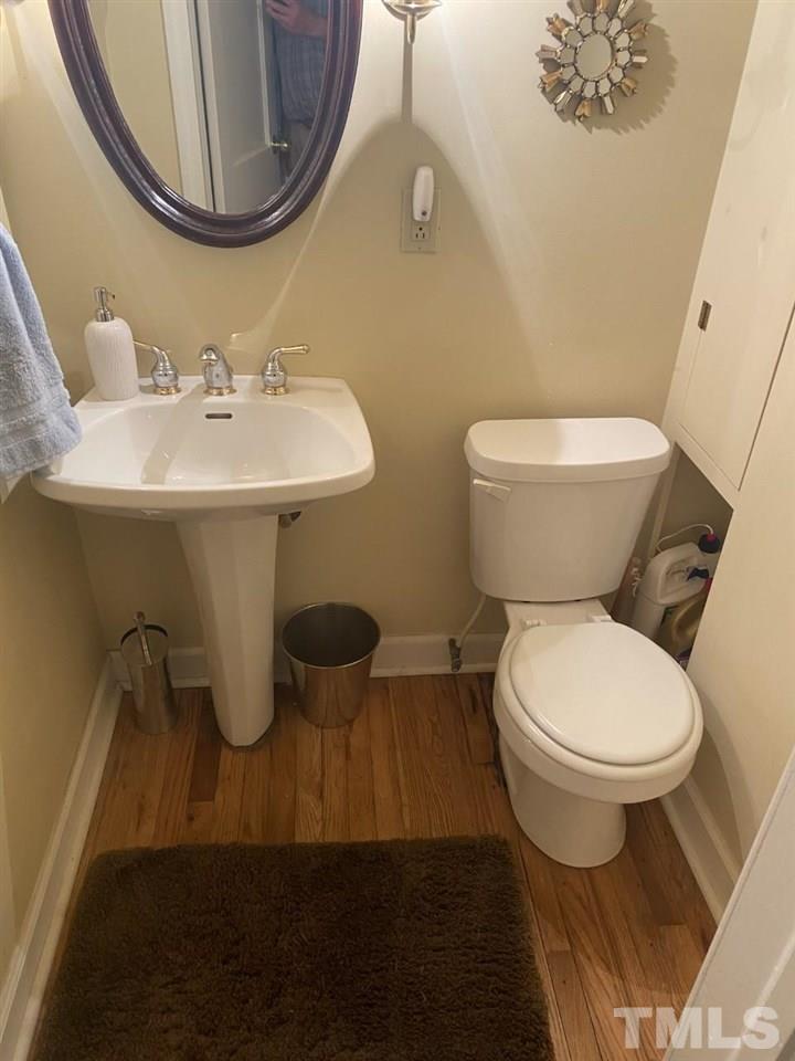 1412 Lyon Street Raleigh, NC 27608 - Photo 5 of 6 a bathroom with a sink and a mirror