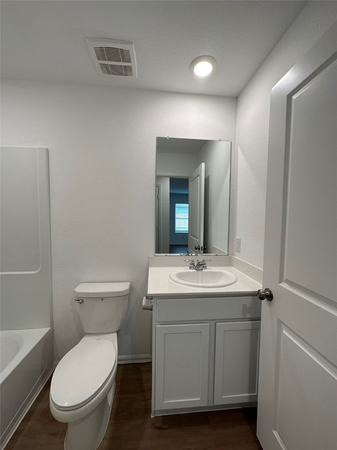 4130 Brazos Brook Trail Baytown, TX 77521 - Photo 11 of 20 a bathroom with a toilet a sink and mirror