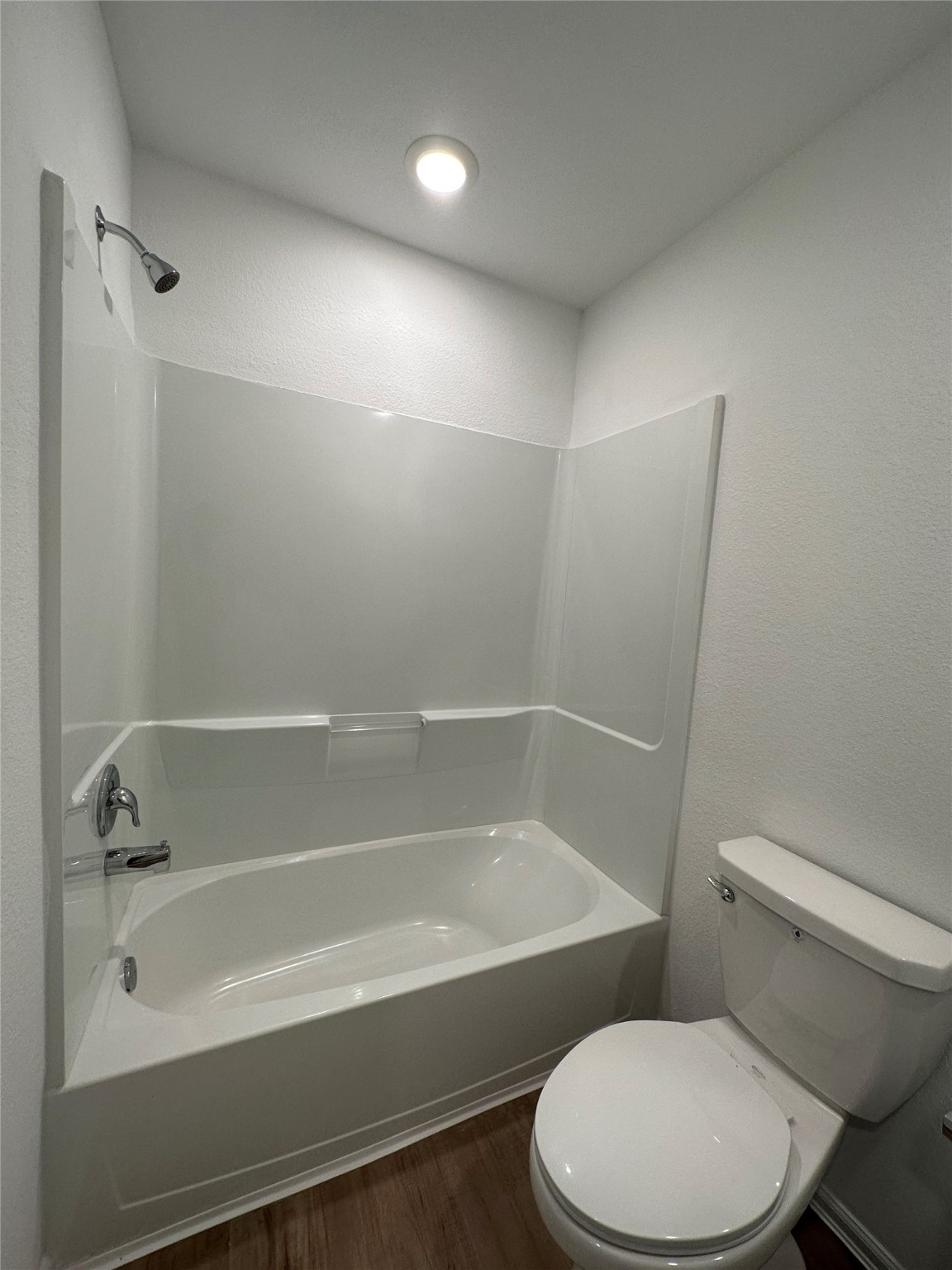 4130 Brazos Brook Trail Baytown, TX 77521 - Photo 12 of 20 a white toilet sitting next to a bath tub
