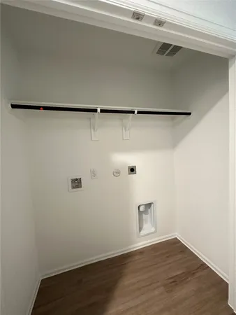 a view of a small space with wooden floor