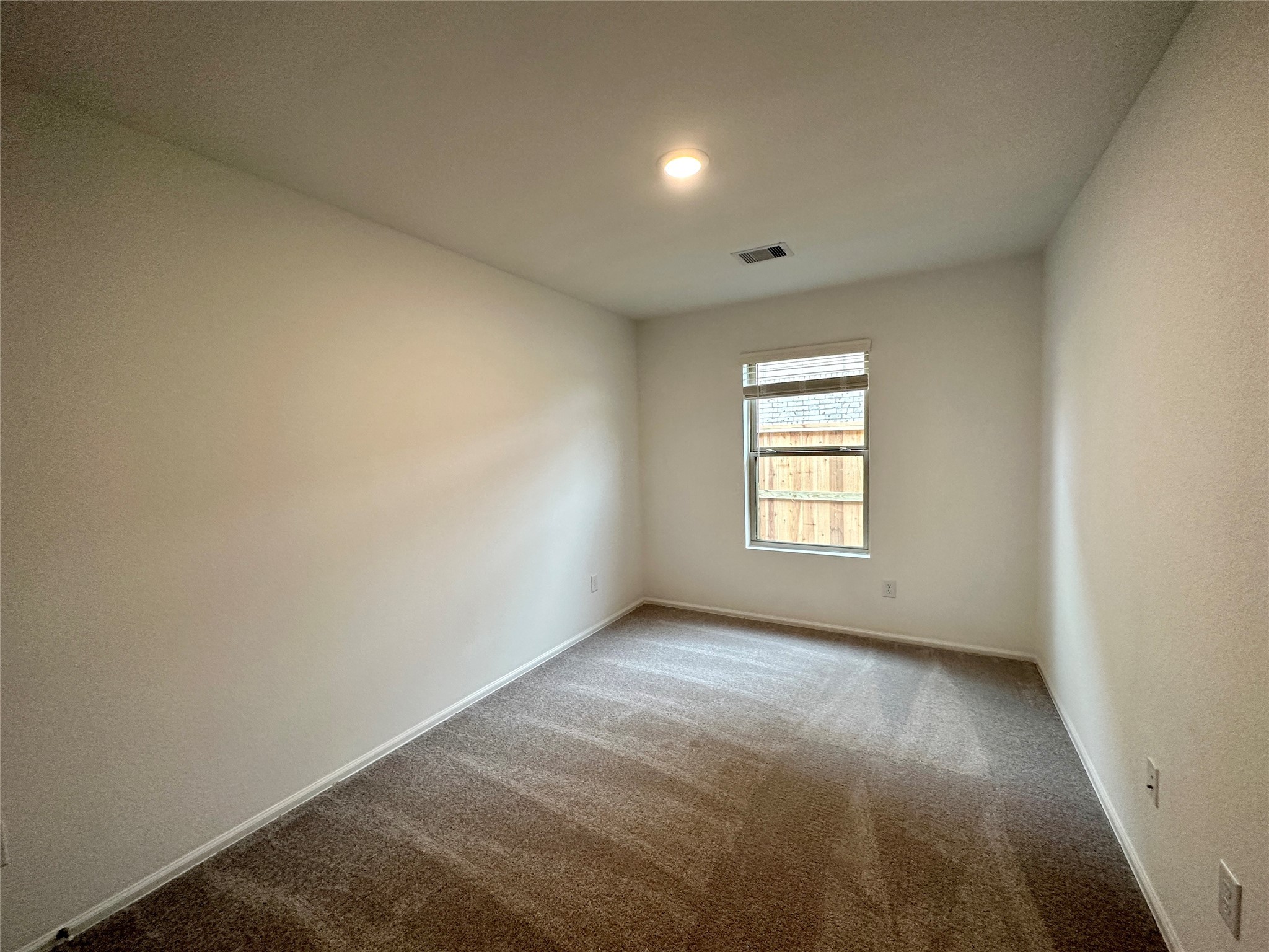 4130 Brazos Brook Trail Baytown, TX 77521 - Photo 15 of 20 a view of an empty room with a window