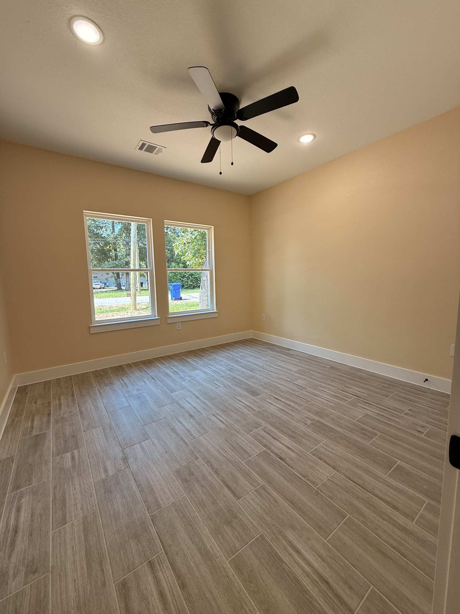 14844 Coaltown Road Willis, TX 77378 - Photo 24 of 30 wooden floor in an empty room with a window