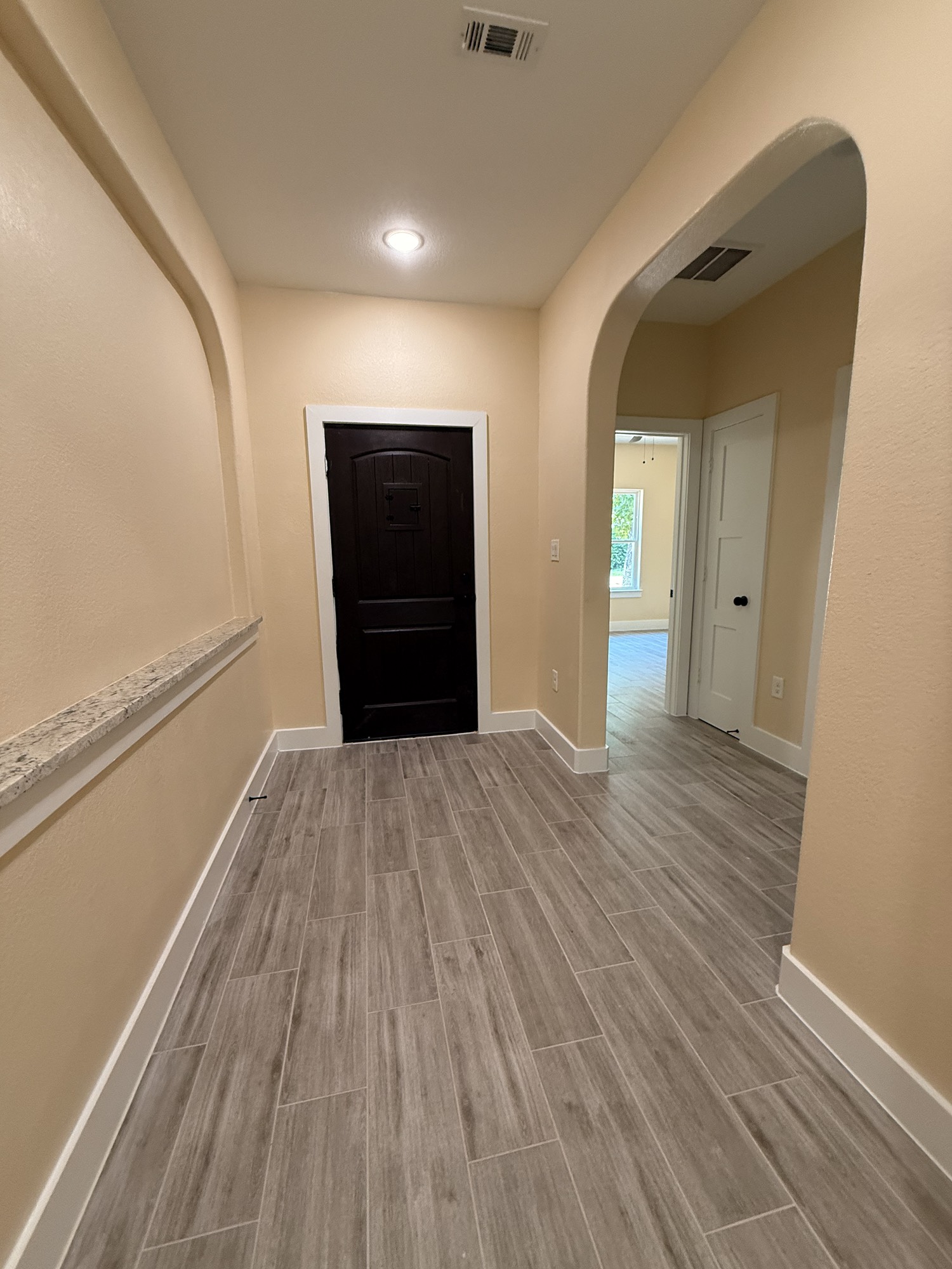 14844 Coaltown Road Willis, TX 77378 - Photo 3 of 30 a view of a hallway with wooden floor