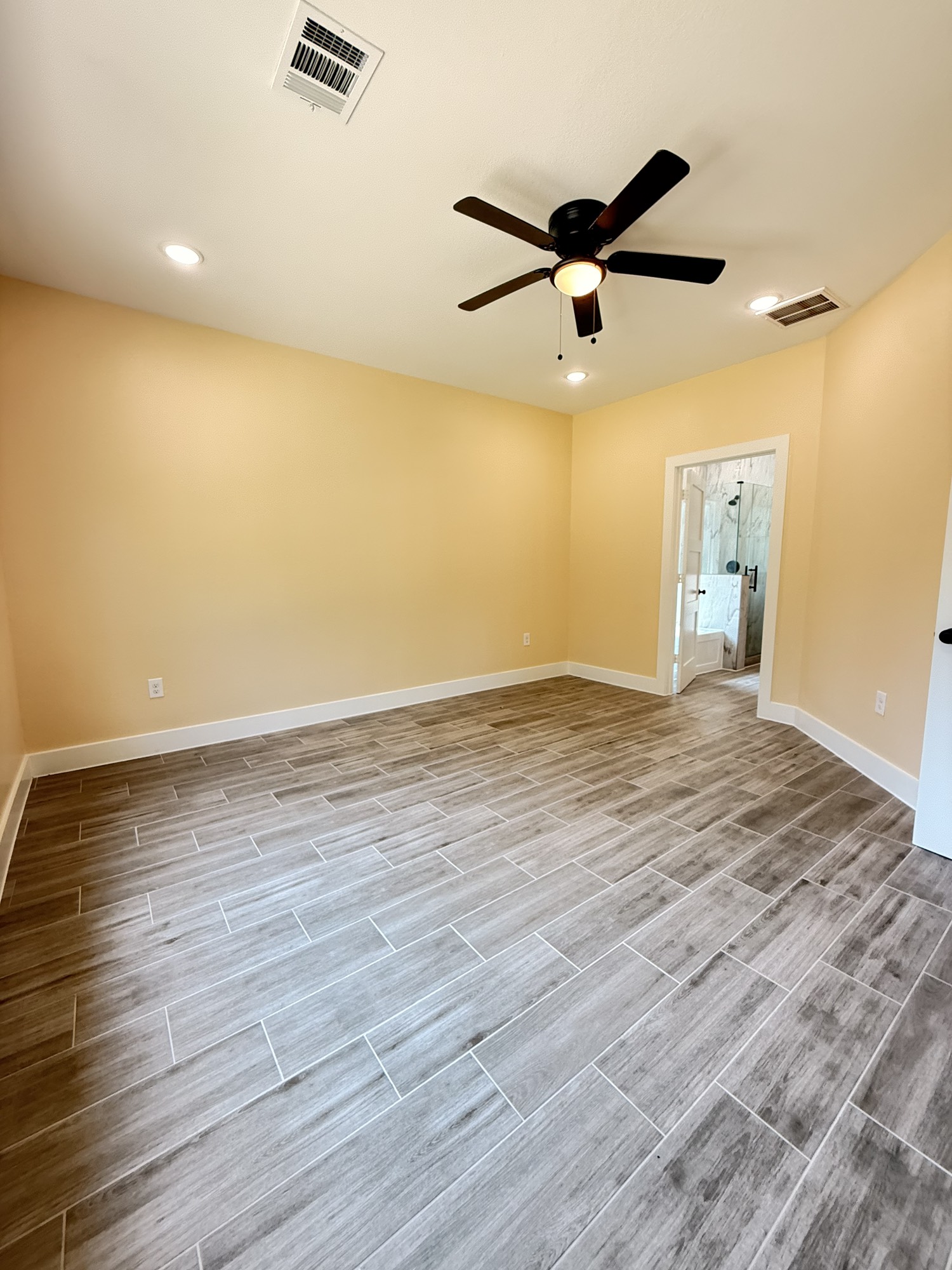 14844 Coaltown Road Willis, TX 77378 - Photo 5 of 30 an empty room with wooden floor and windows