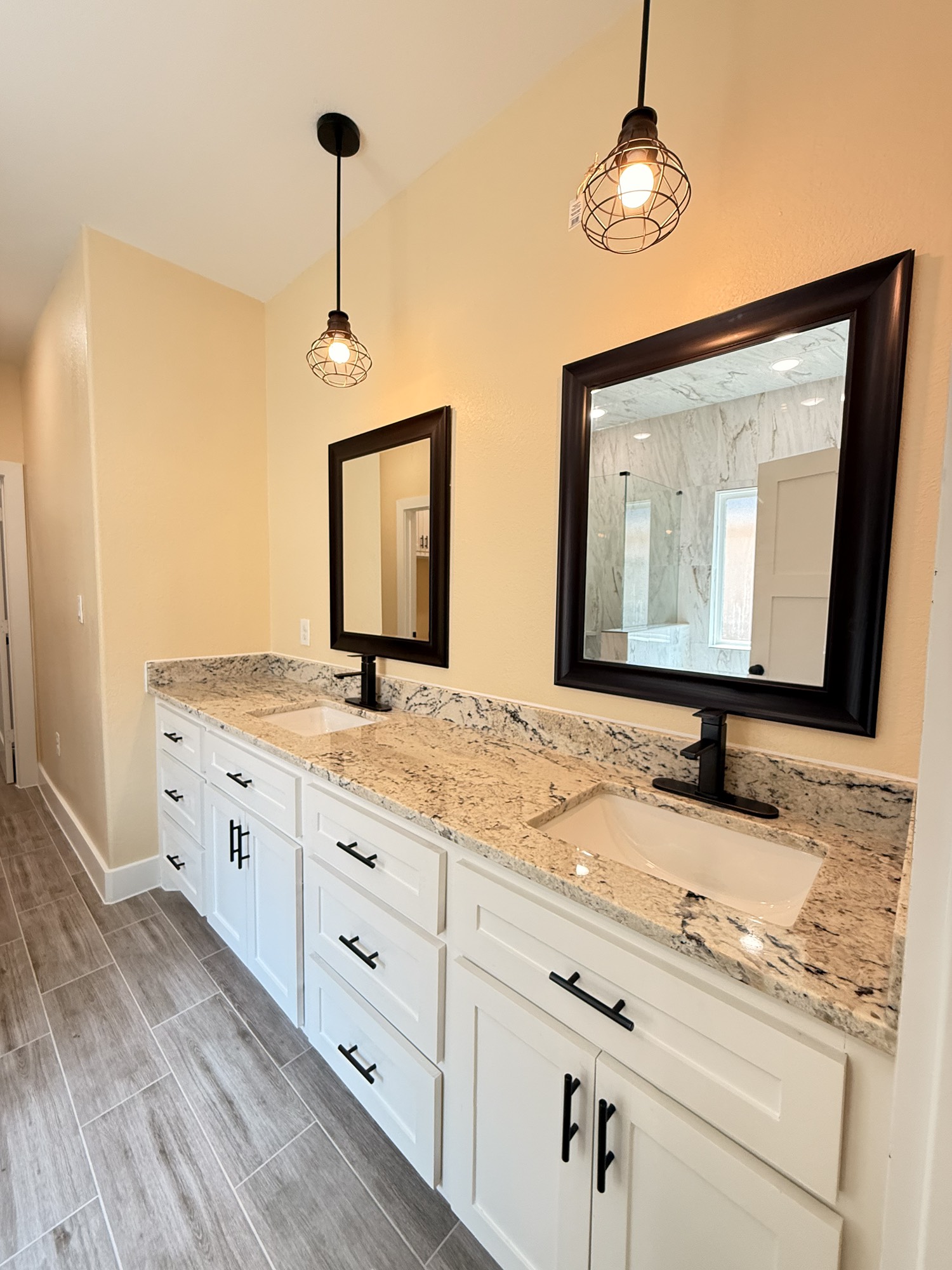 14844 Coaltown Road Willis, TX 77378 - Photo 6 of 30 a bathroom with a granite countertop double vanity sink and a mirror