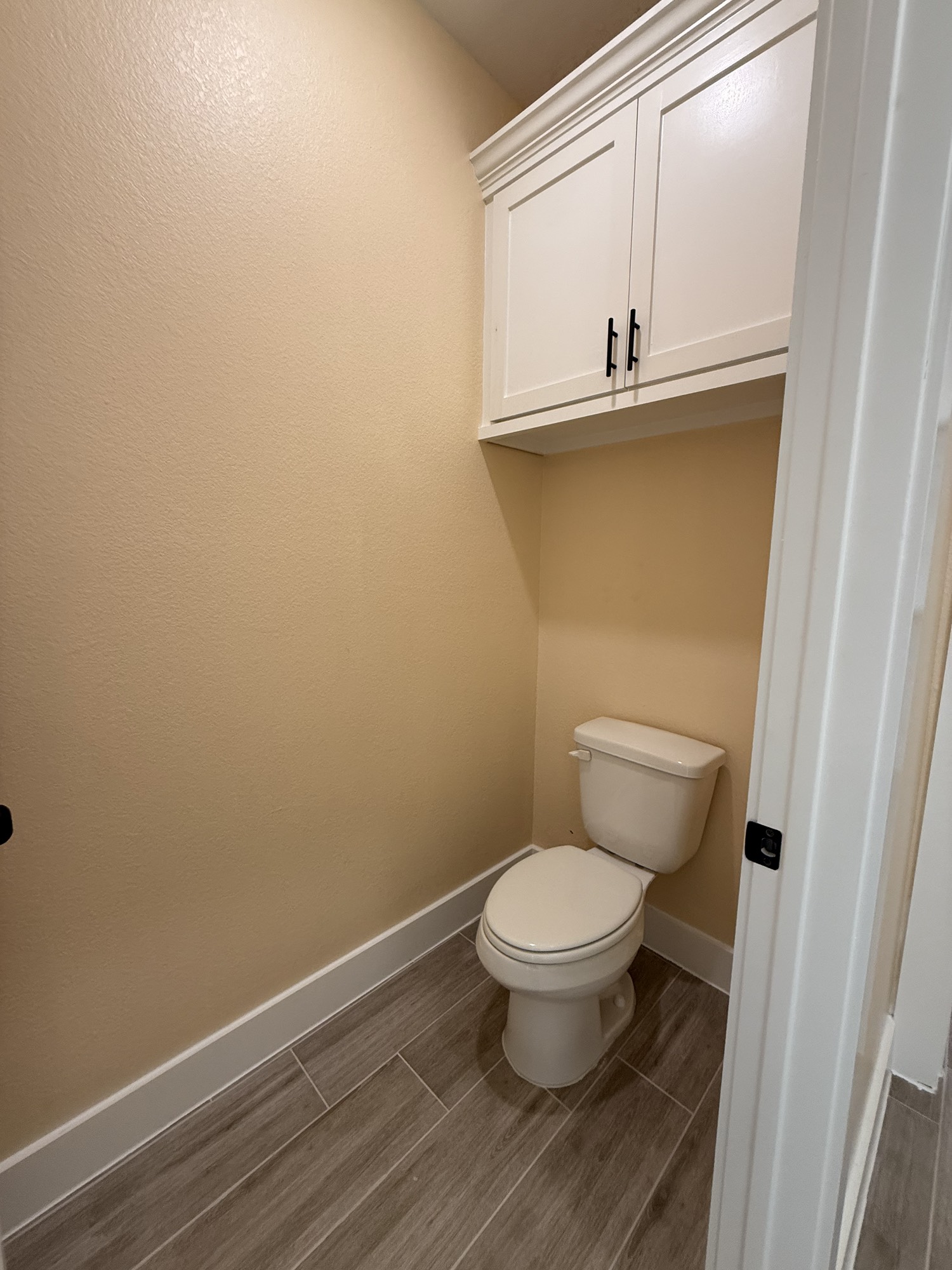 14844 Coaltown Road Willis, TX 77378 - Photo 10 of 30 a bathroom with a toilet and a window