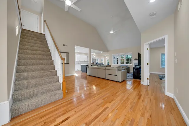 a bedroom with a bed and a large mirror