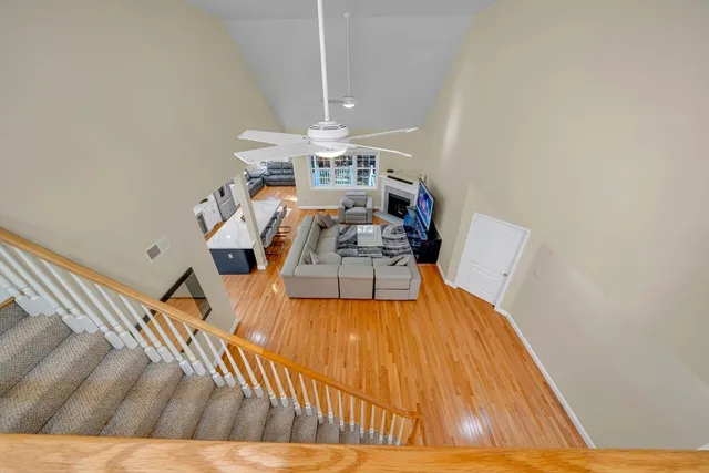 a bathroom with a tub sink and glass door