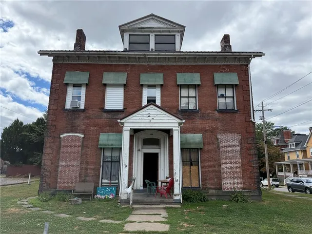 front view of a house with a yard