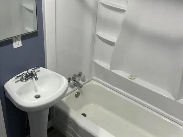 a bathroom with a sink and a bathtub