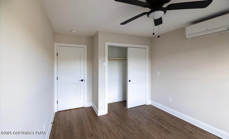 611 Main Street, Unit 201 Stroudsburg, PA 18360 - Photo 6 of 9 a view of an empty room with a window and wooden floor
