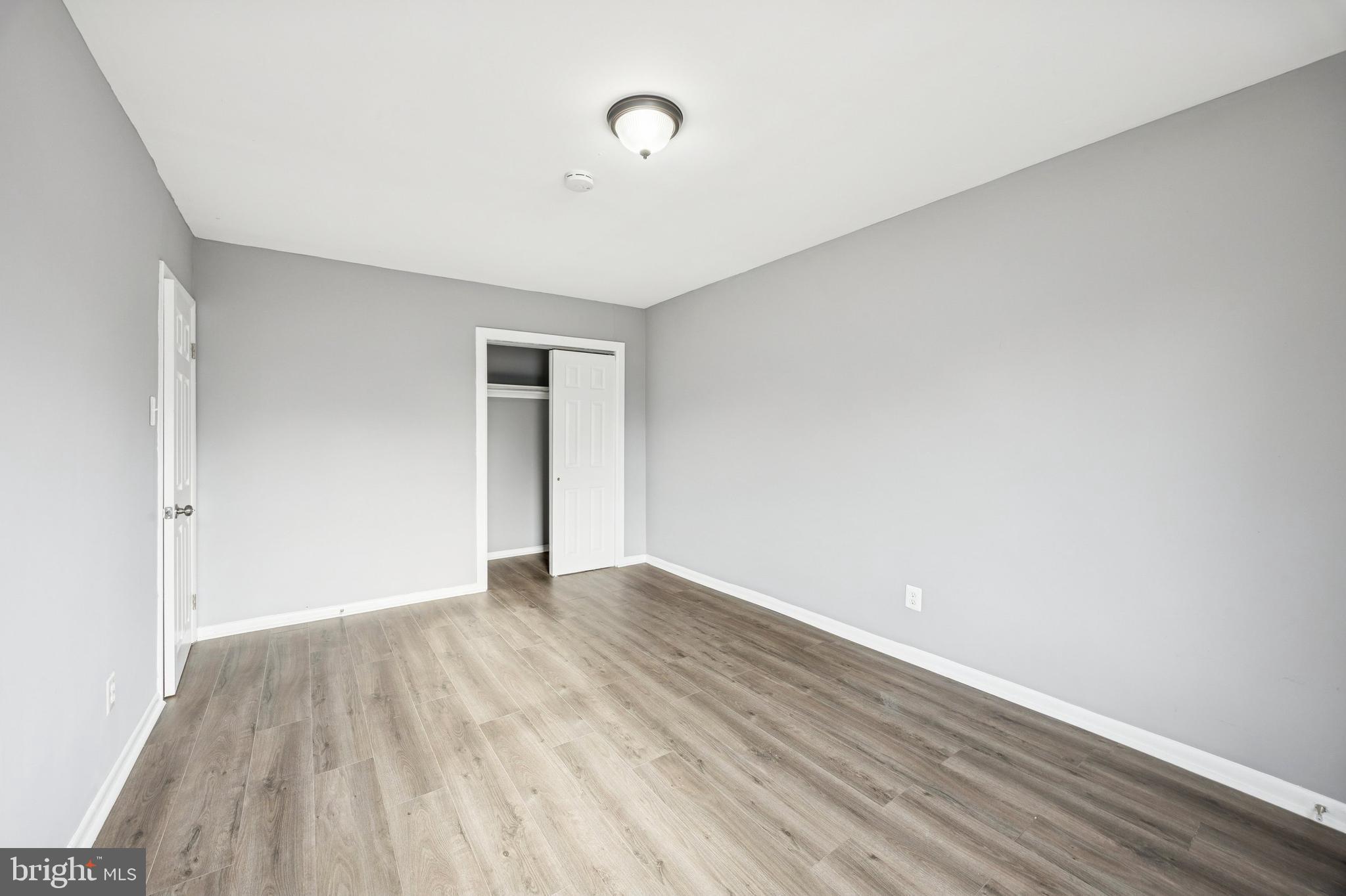 1340 West 7th Street Chester, PA 19013 - Photo 12 of 15 a view of an empty room with wooden floor