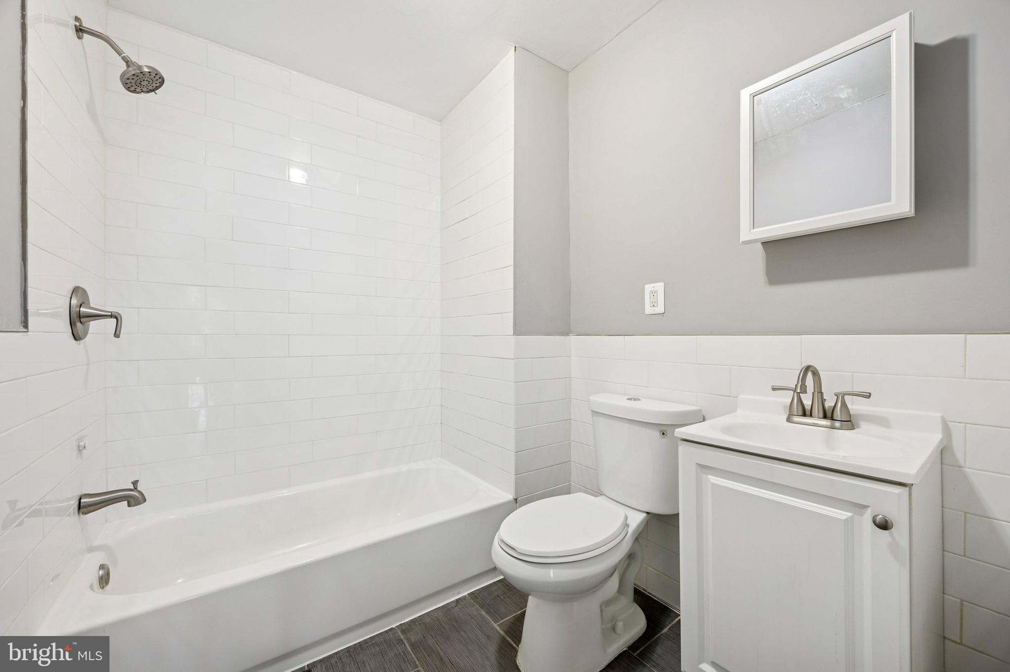 1340 West 7th Street Chester, PA 19013 - Photo 13 of 15 a bathroom with a sink toilet and bathtub
