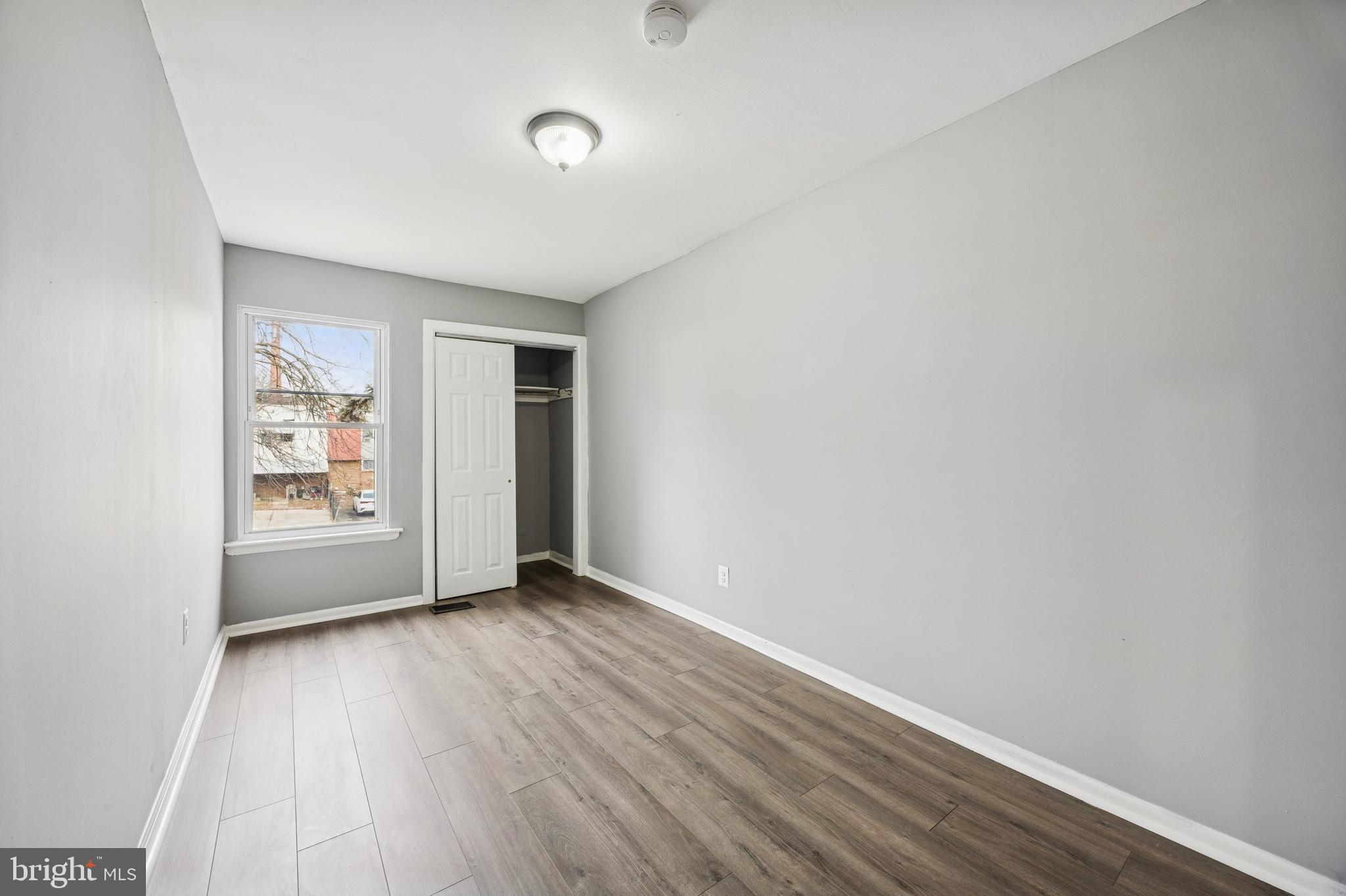 1340 West 7th Street Chester, PA 19013 - Photo 9 of 15 a view of an empty room with closet and a window