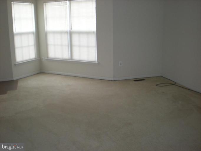 619 Tivoli Road Frederick, MD 21703 - Photo 4 of 5 an empty room with a window