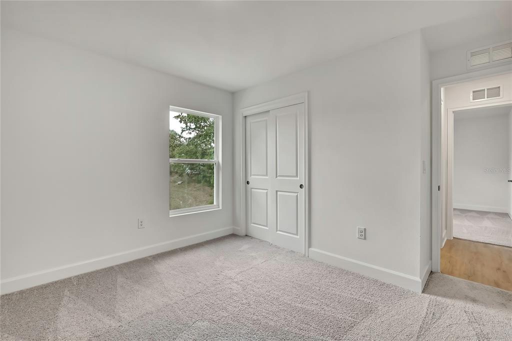 3646 Portillo Road Spring Hill, FL 34608 - Photo 13 of 16 a view of an empty room with a window