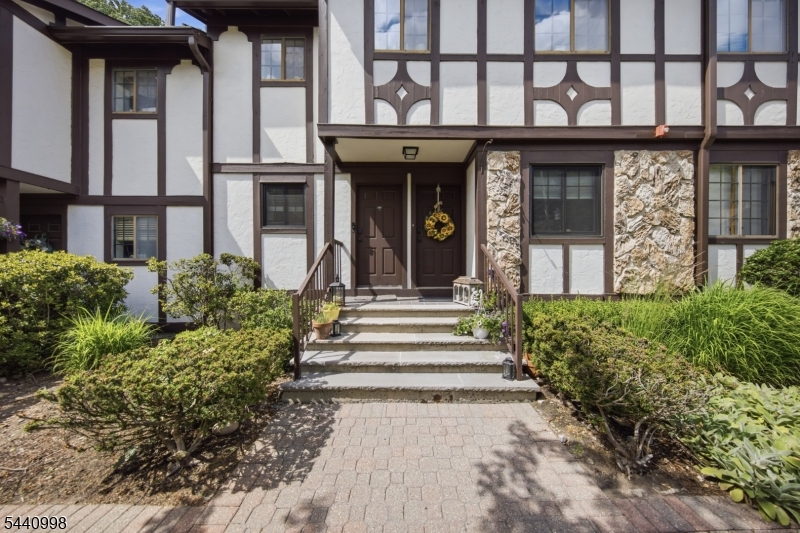 a view of a house with a window and stairs