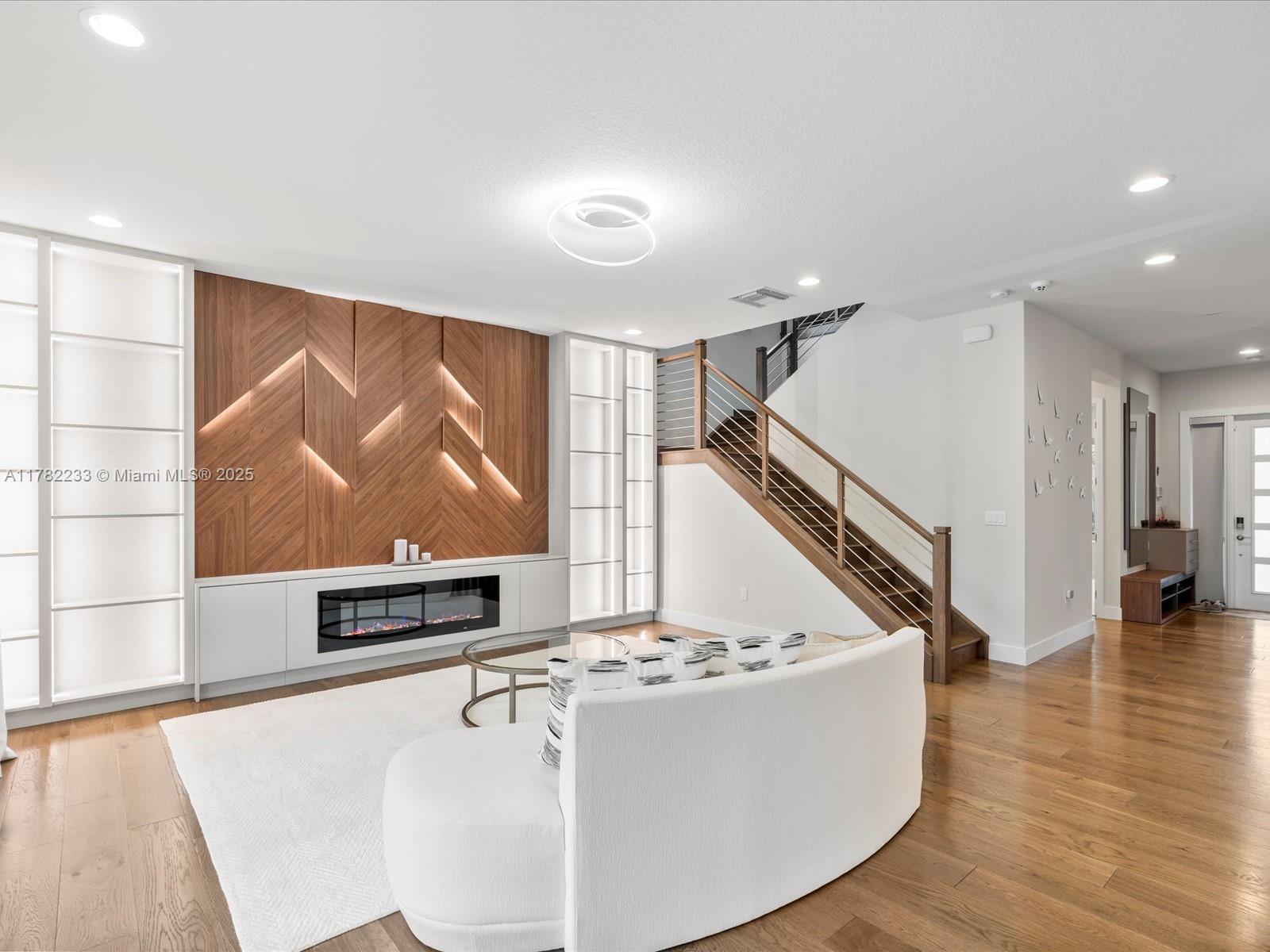 20324 Castle Stuart Avenue Boca Raton, FL 33434 - Photo 12 of 79 a living room with furniture and a flat screen tv