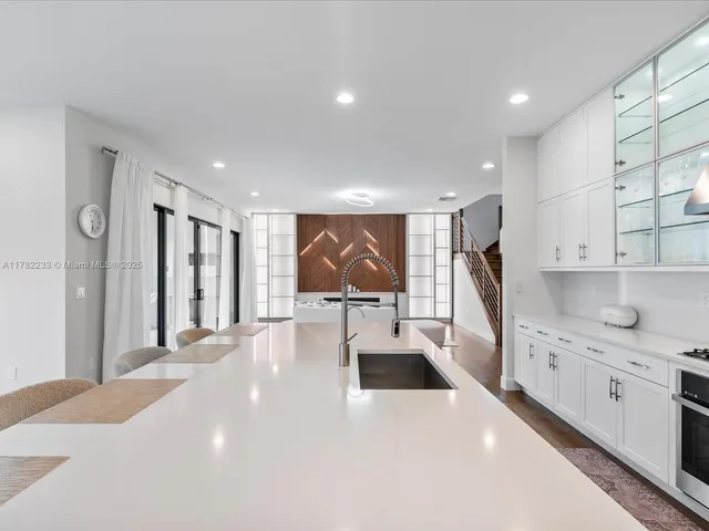 a view of a dining room with furniture large window and outside view