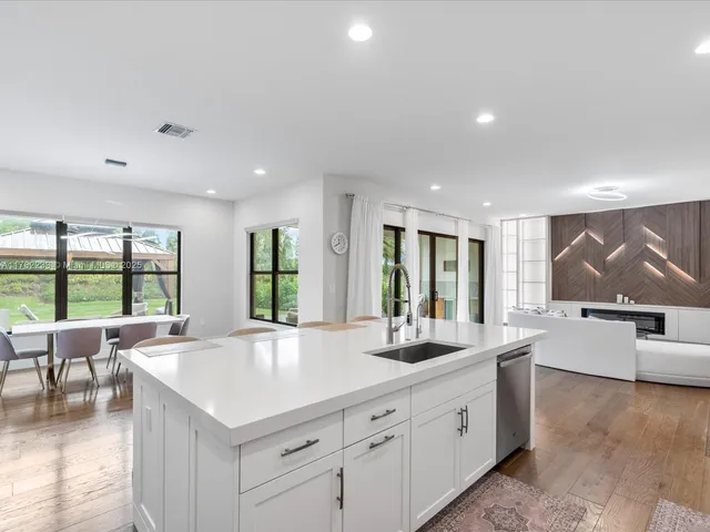 a dining room with a table and chairs