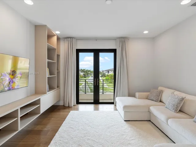 a bedroom with bed and a window