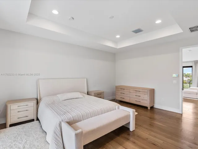 a view of walk in closet with clothes