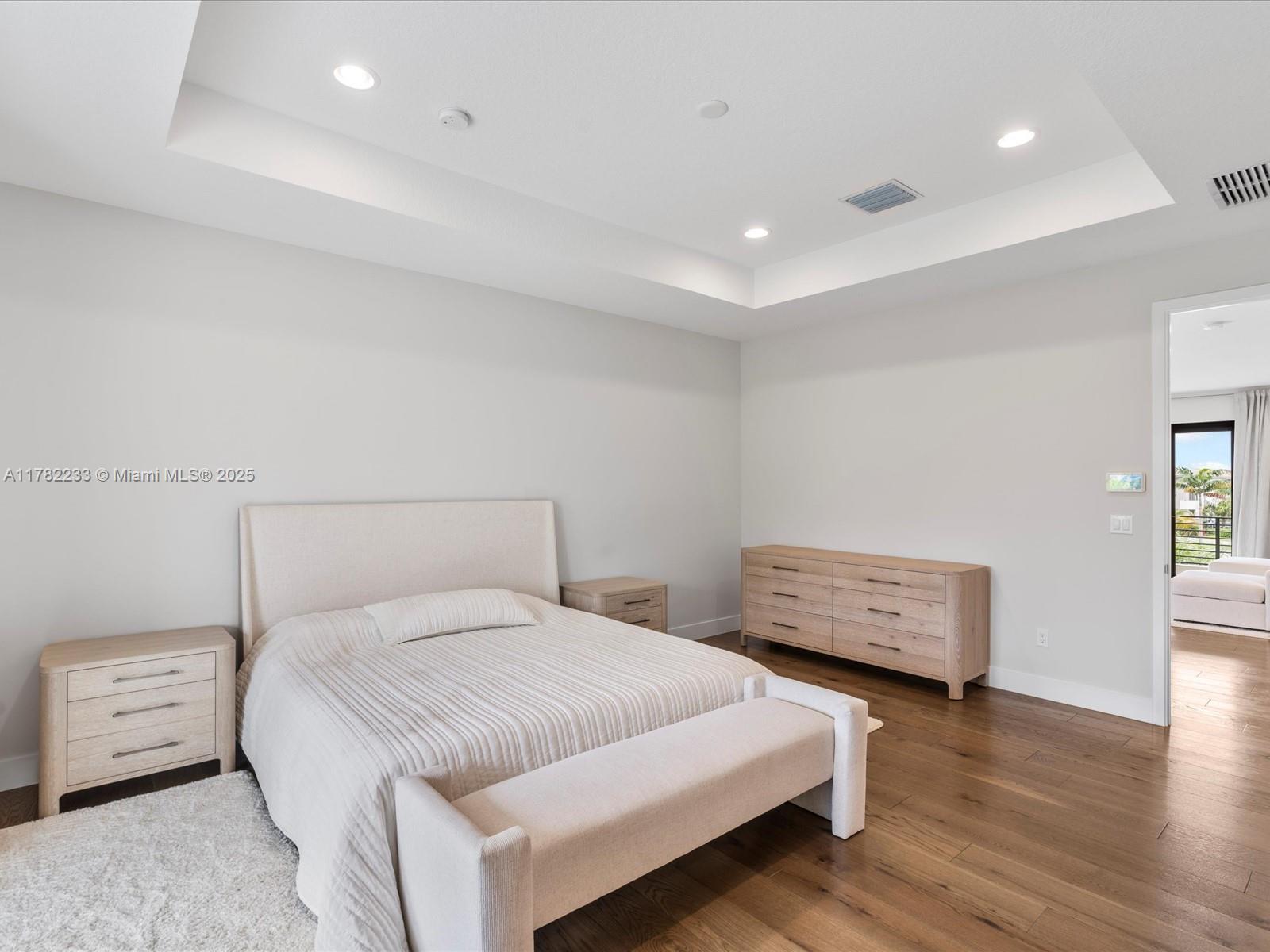 20324 Castle Stuart Avenue Boca Raton, FL 33434 - Photo 34 of 79 a bedroom with a bed and a night stand