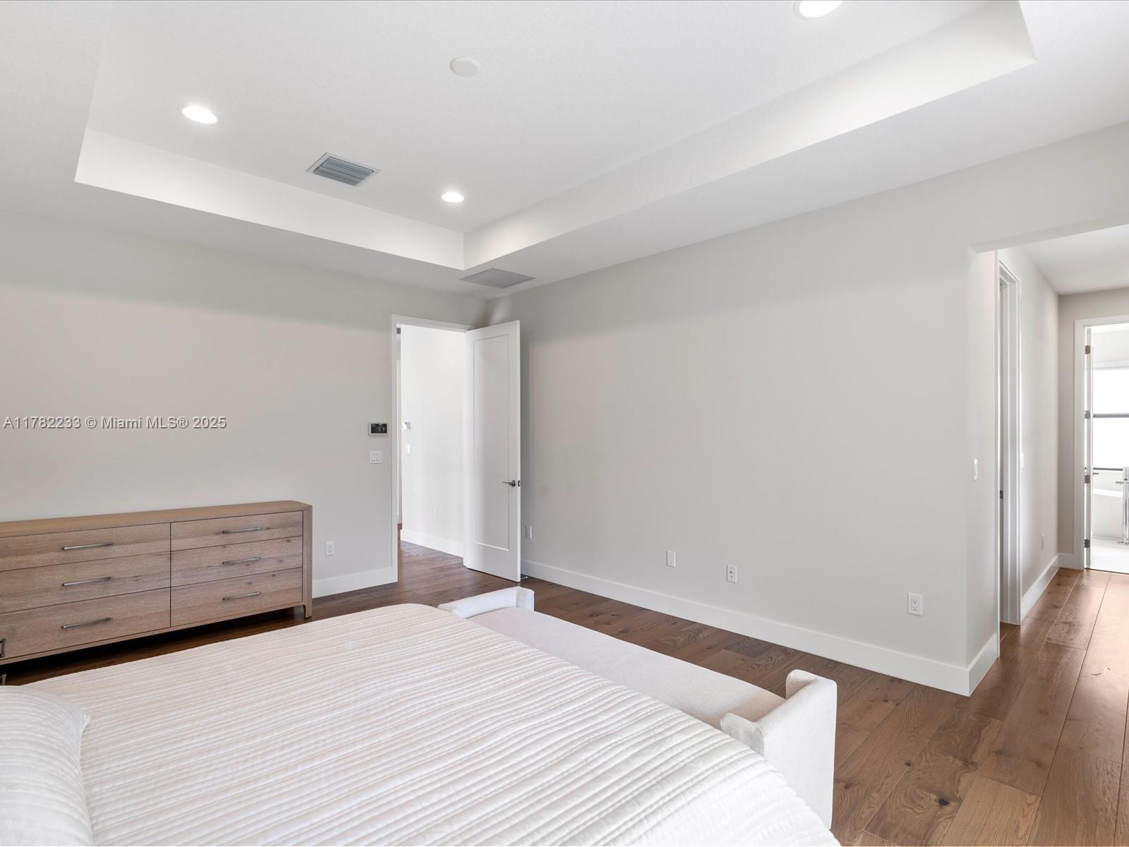 20324 Castle Stuart Avenue Boca Raton, FL 33434 - Photo 36 of 79 a bedroom with a bed and a window