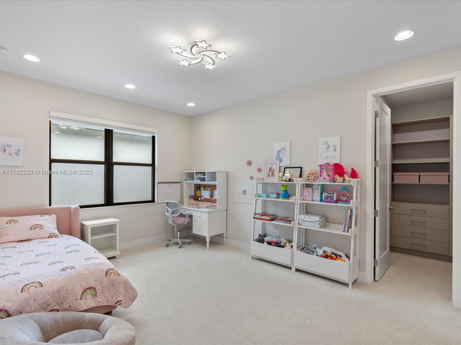 20324 Castle Stuart Avenue Boca Raton, FL 33434 - Photo 44 of 79 a bedroom with bed and a window