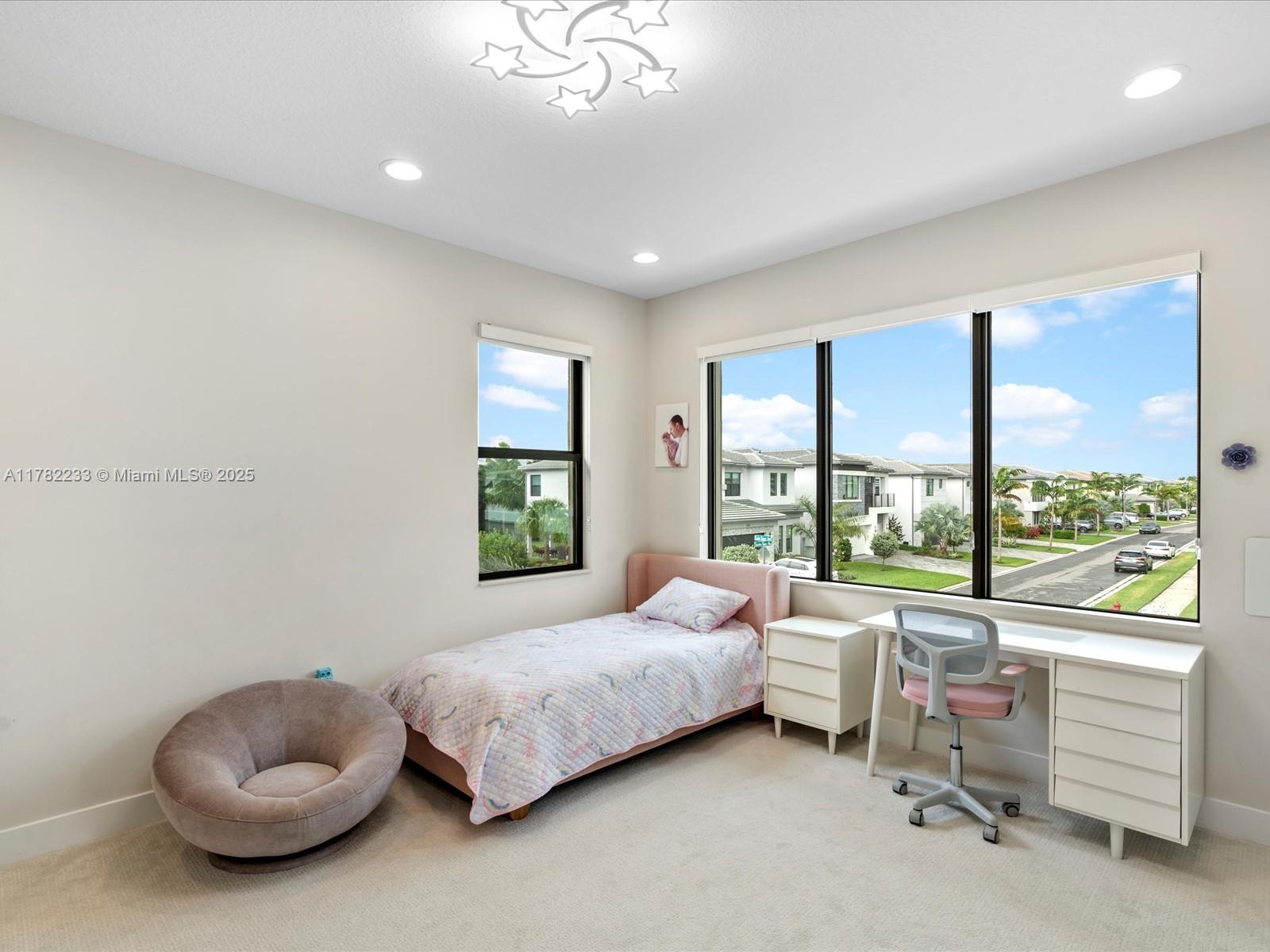 20324 Castle Stuart Avenue Boca Raton, FL 33434 - Photo 48 of 79 a bedroom with a bed and a large window