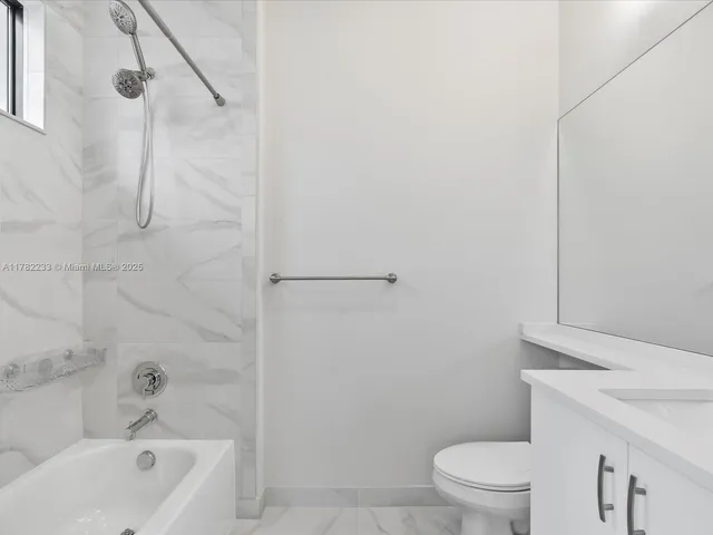 a view of swimming pool with a garden and outdoor seating