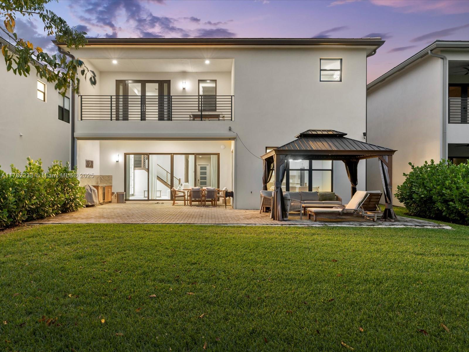 20324 Castle Stuart Avenue Boca Raton, FL 33434 - Photo 57 of 79 a view of a house with backyard and sitting area
