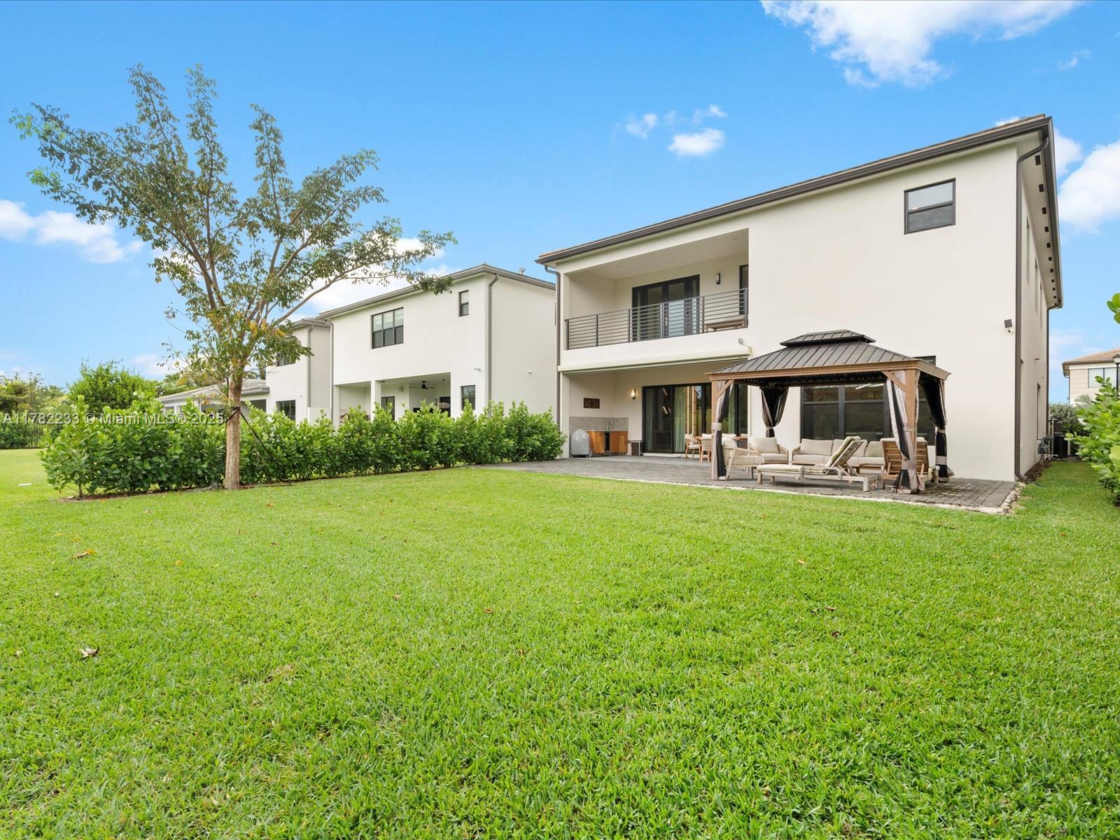 20324 Castle Stuart Avenue Boca Raton, FL 33434 - Photo 62 of 79 a front view of a house with garden