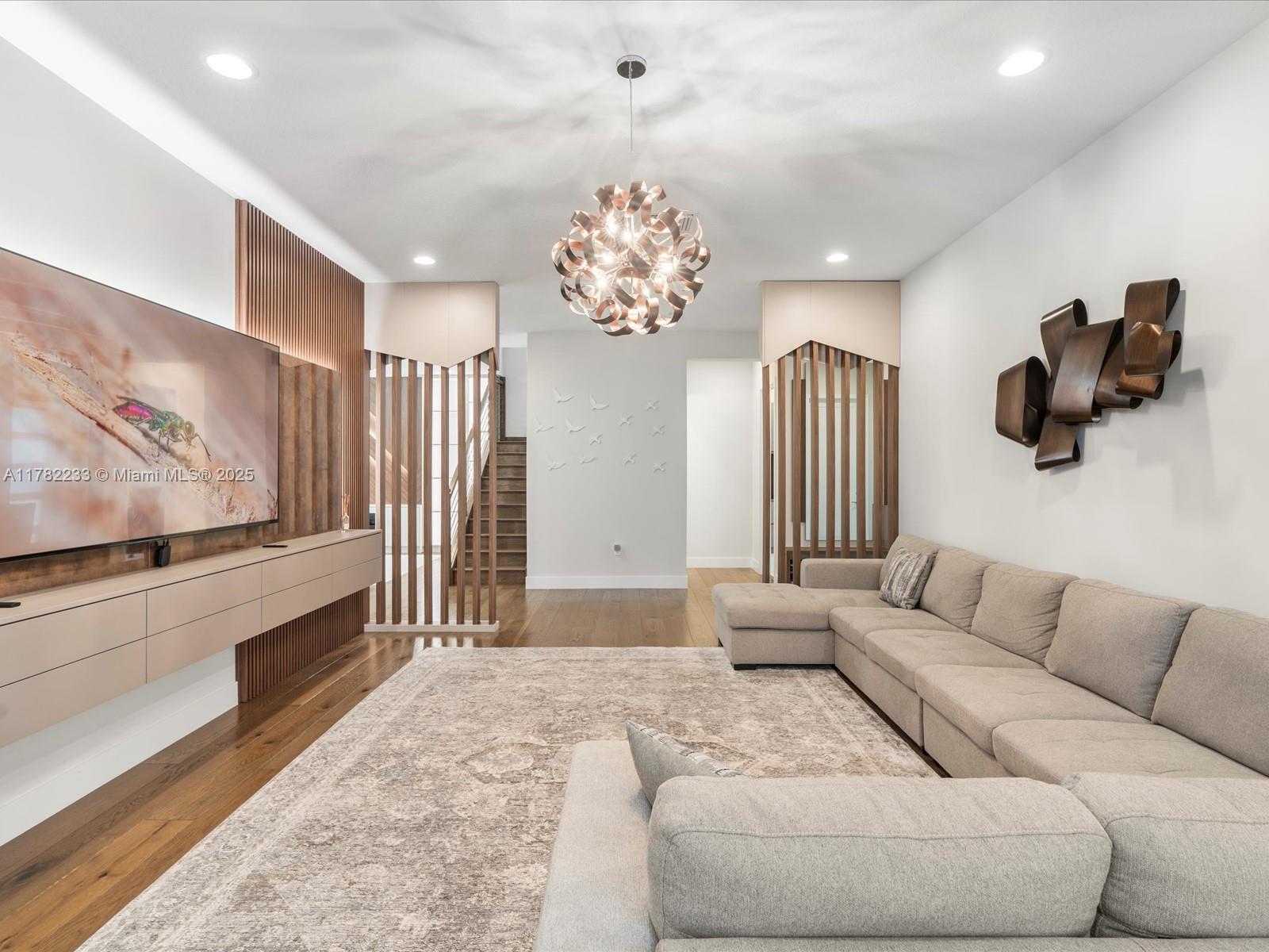 20324 Castle Stuart Avenue Boca Raton, FL 33434 - Photo 10 of 79 a living room with furniture and a chandelier