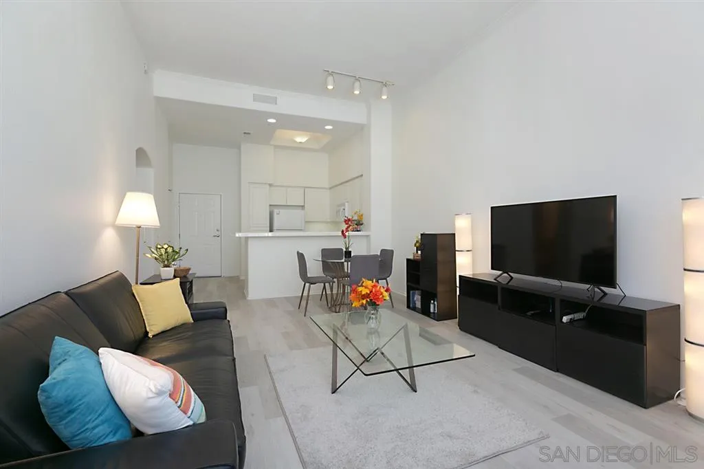 9237 Regents Road, Unit K401 La Jolla, CA 92037 - Photo 11 of 25 a living room with furniture and a flat screen tv