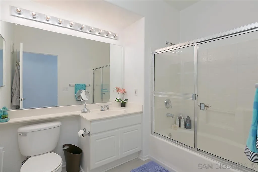9237 Regents Road, Unit K401 La Jolla, CA 92037 - Photo 16 of 25 a bathroom with a sink a toilet and shower