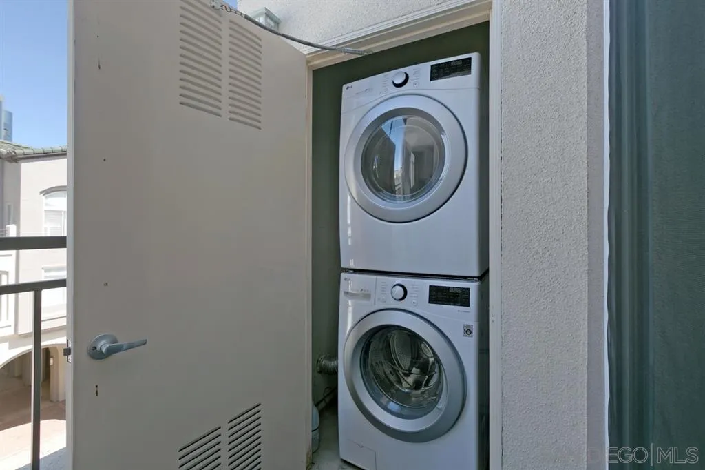 9237 Regents Road, Unit K401 La Jolla, CA 92037 - Photo 18 of 25 a utility room with dryer and washer