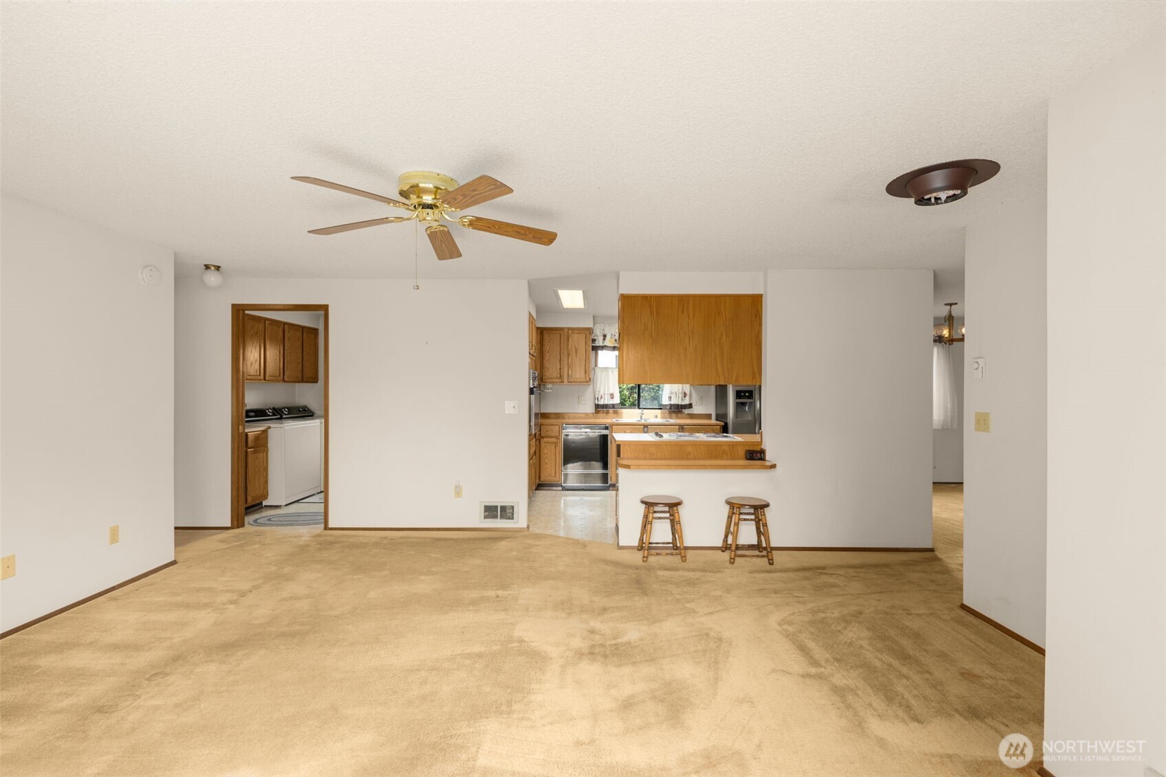 24124 8th Place West Bothell, WA 98021 - Photo 13 of 39 a view of a kitchen with a sink hardwood floor and a view of kitchen