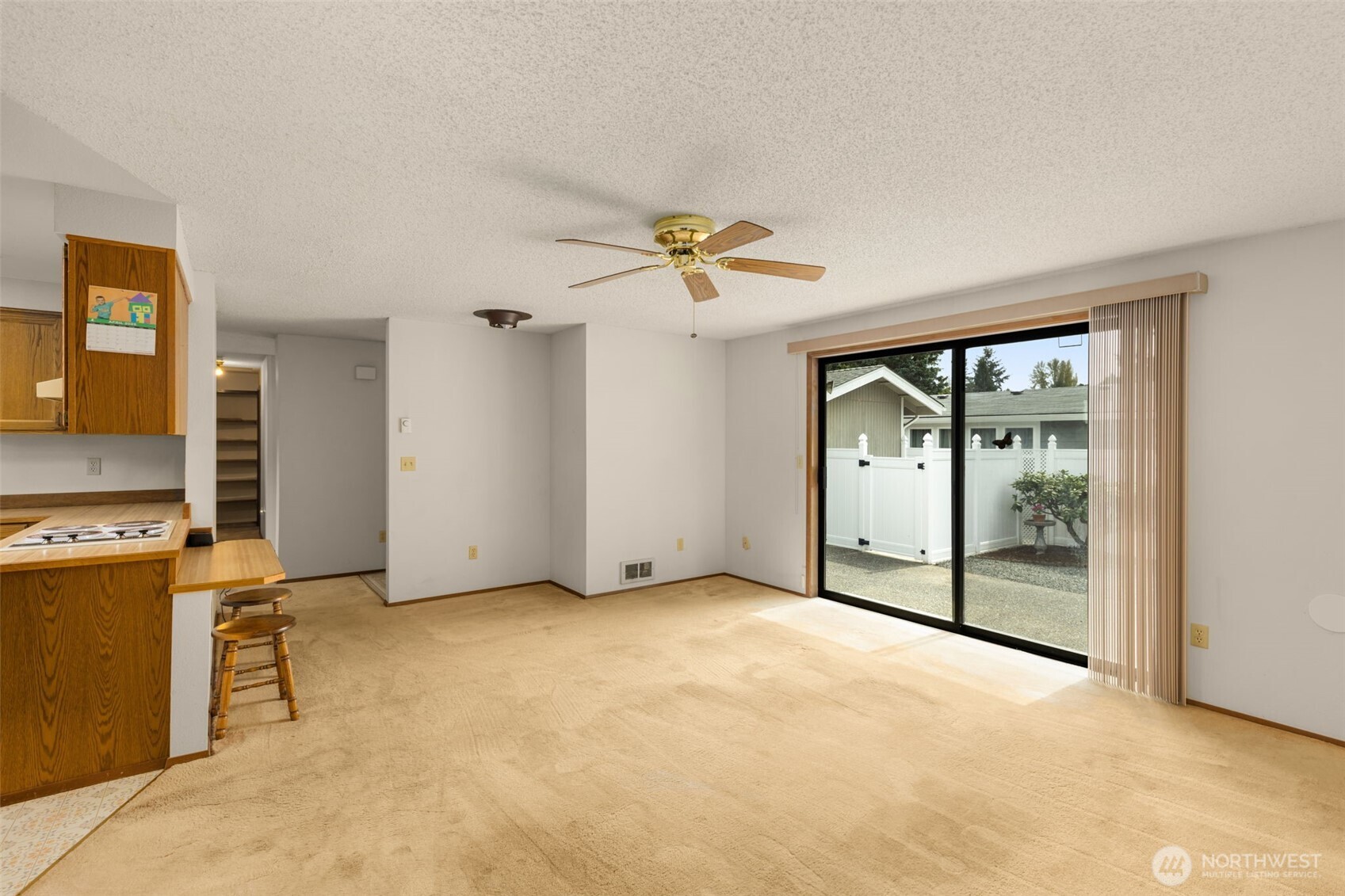 24124 8th Place West Bothell, WA 98021 - Photo 14 of 39 an empty room with a fireplace and a chandelier