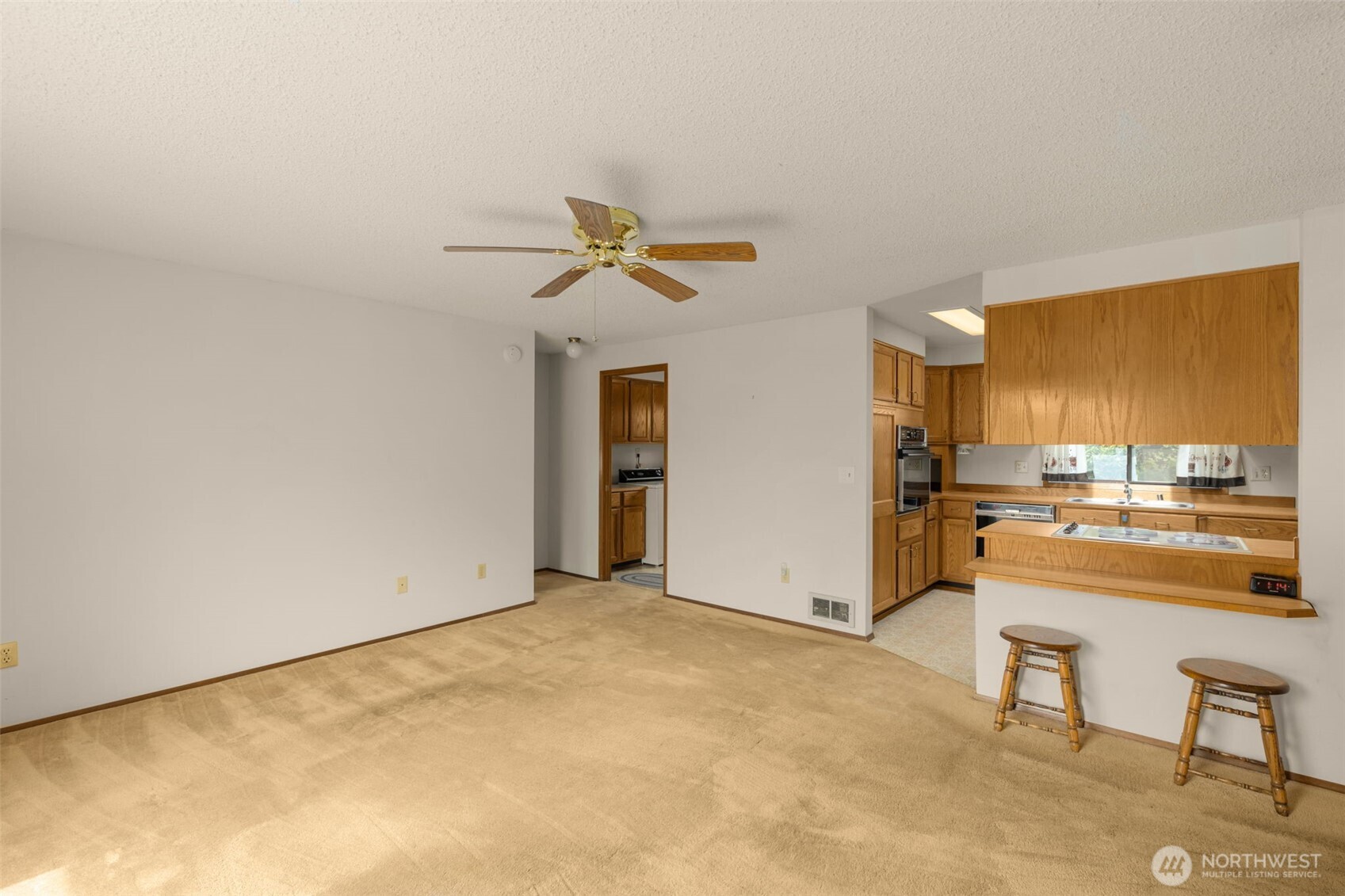 24124 8th Place West Bothell, WA 98021 - Photo 15 of 39 a view of a livingroom with wooden floor and a ceiling fan