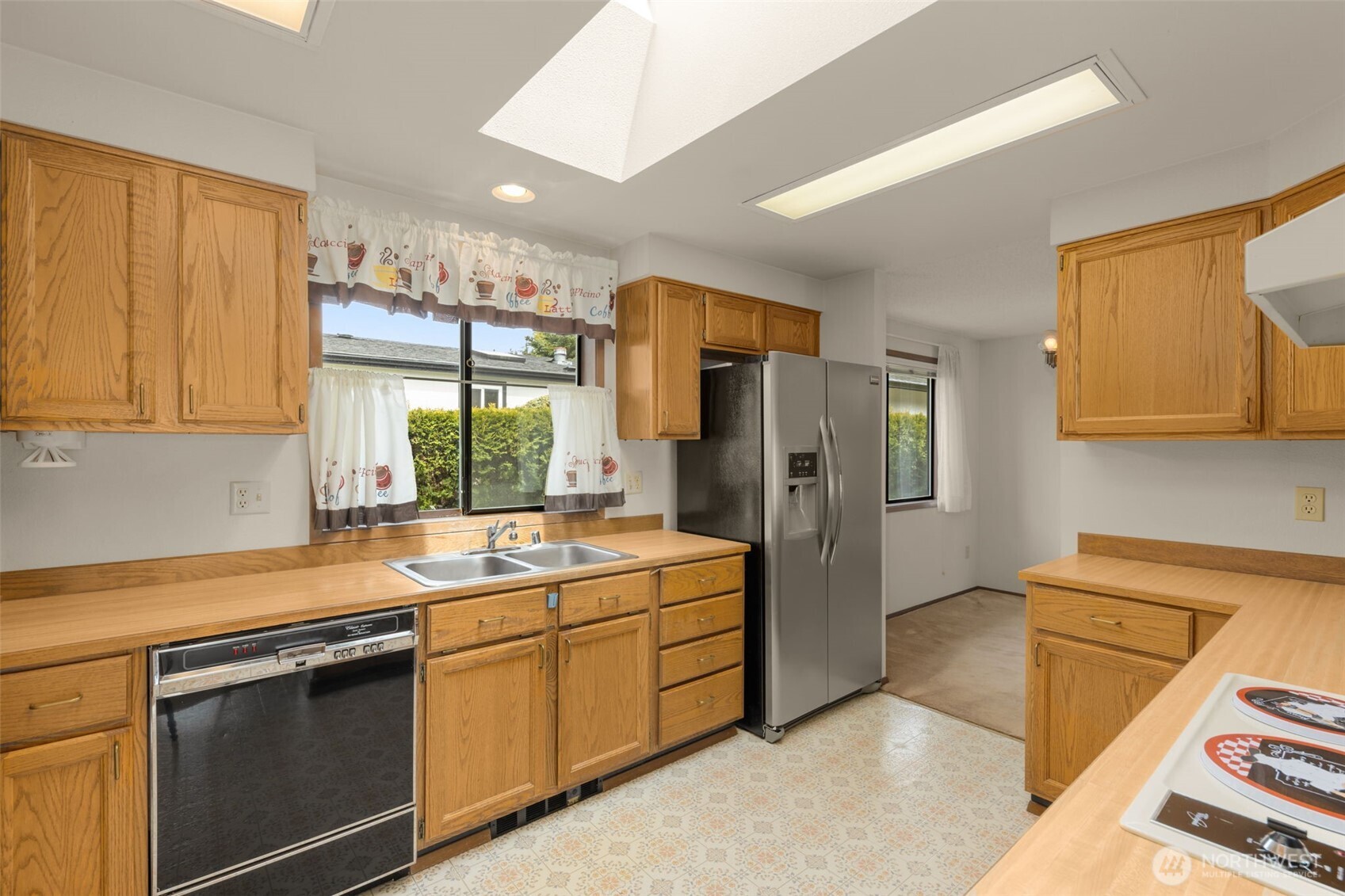 24124 8th Place West Bothell, WA 98021 - Photo 17 of 39 a kitchen with a sink stove and refrigerator
