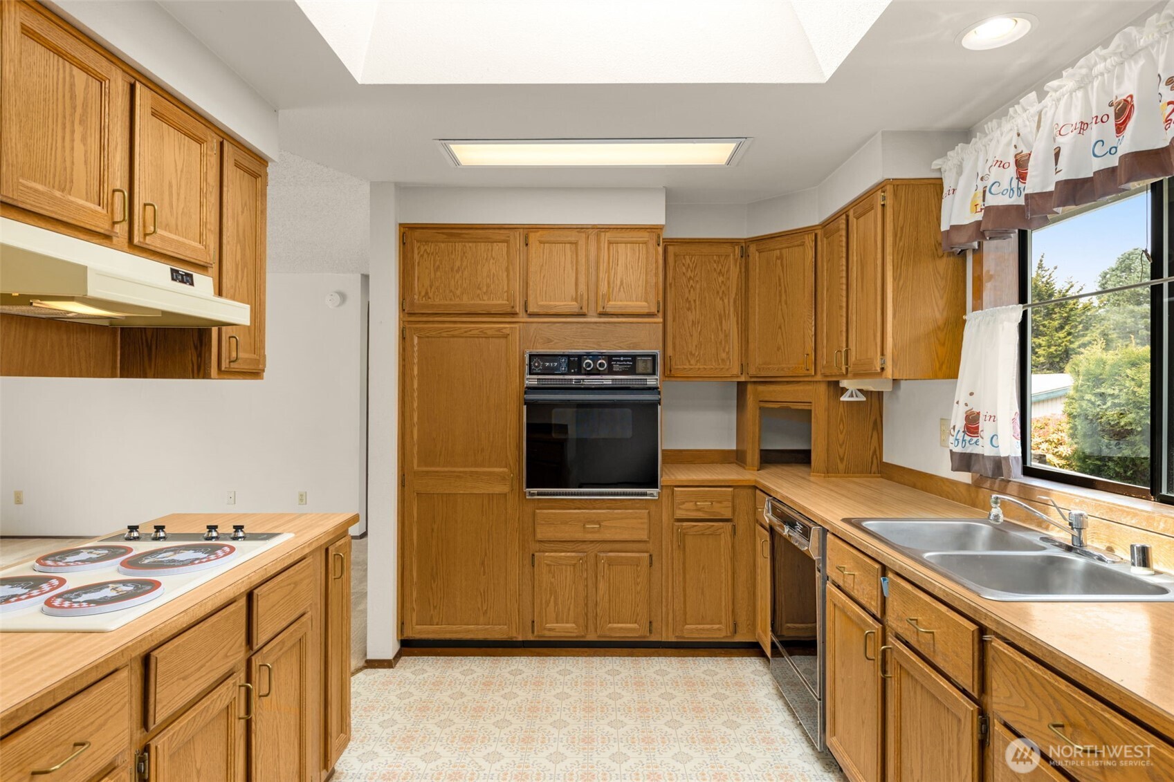 24124 8th Place West Bothell, WA 98021 - Photo 18 of 39 a kitchen with a sink stove and refrigerator