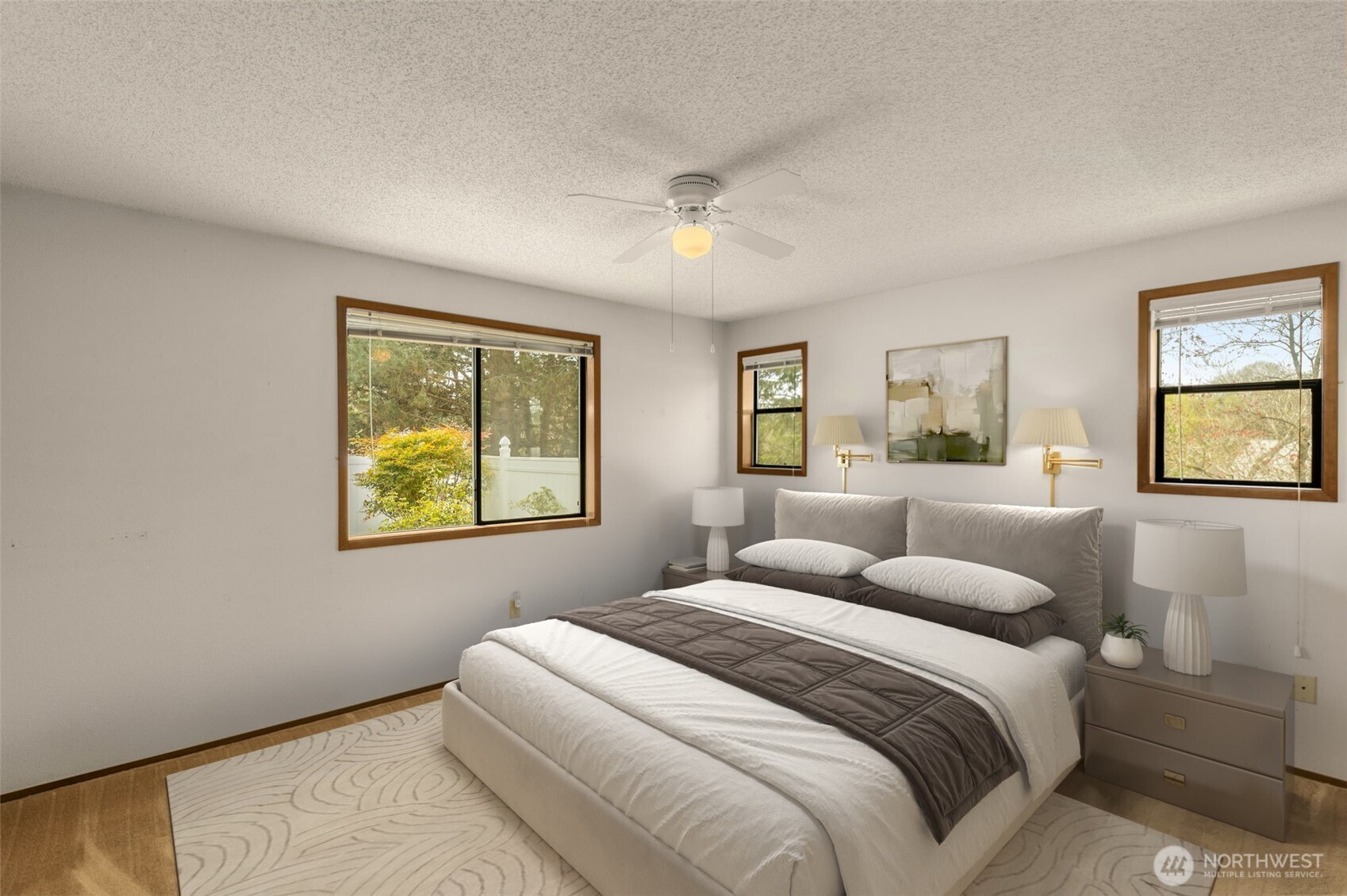 24124 8th Place West Bothell, WA 98021 - Photo 19 of 39 a bedroom with a bed and a painting on the wall