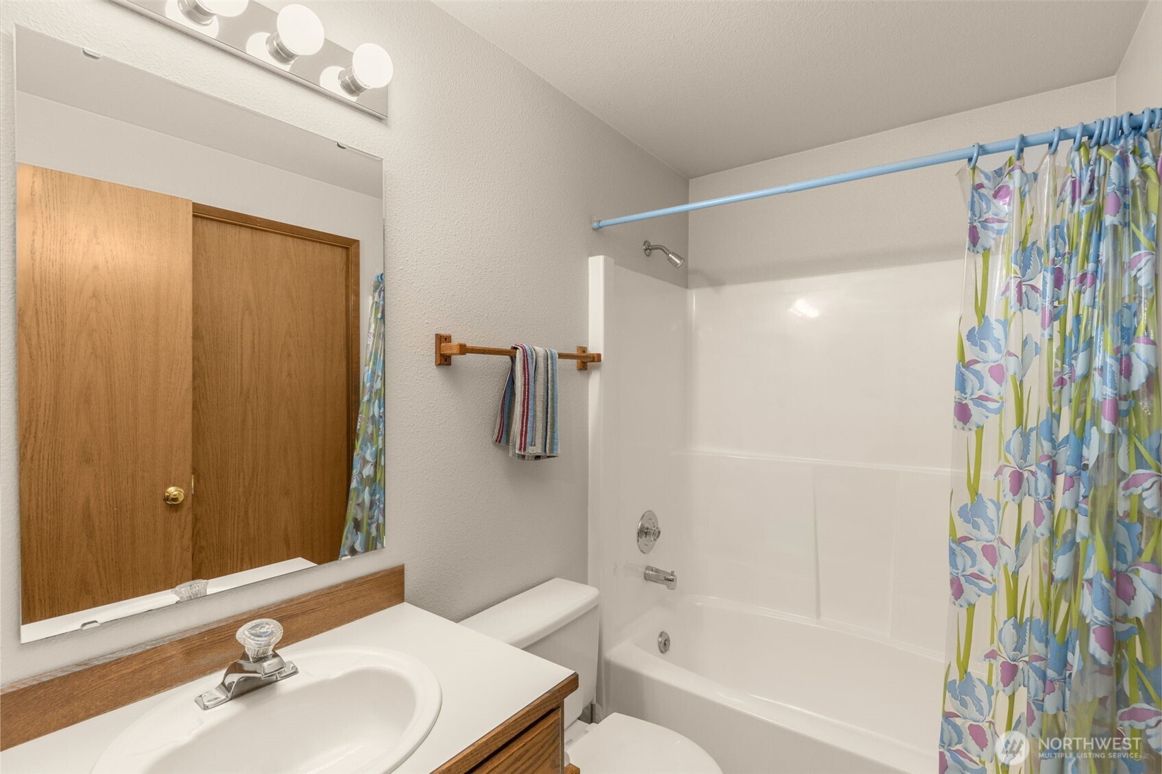 24124 8th Place West Bothell, WA 98021 - Photo 25 of 39 a bathroom with a shower curtain and a sink