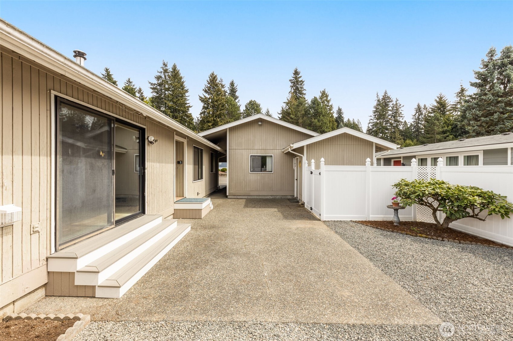 24124 8th Place West Bothell, WA 98021 - Photo 27 of 39 a view of house with a yard and potted plants