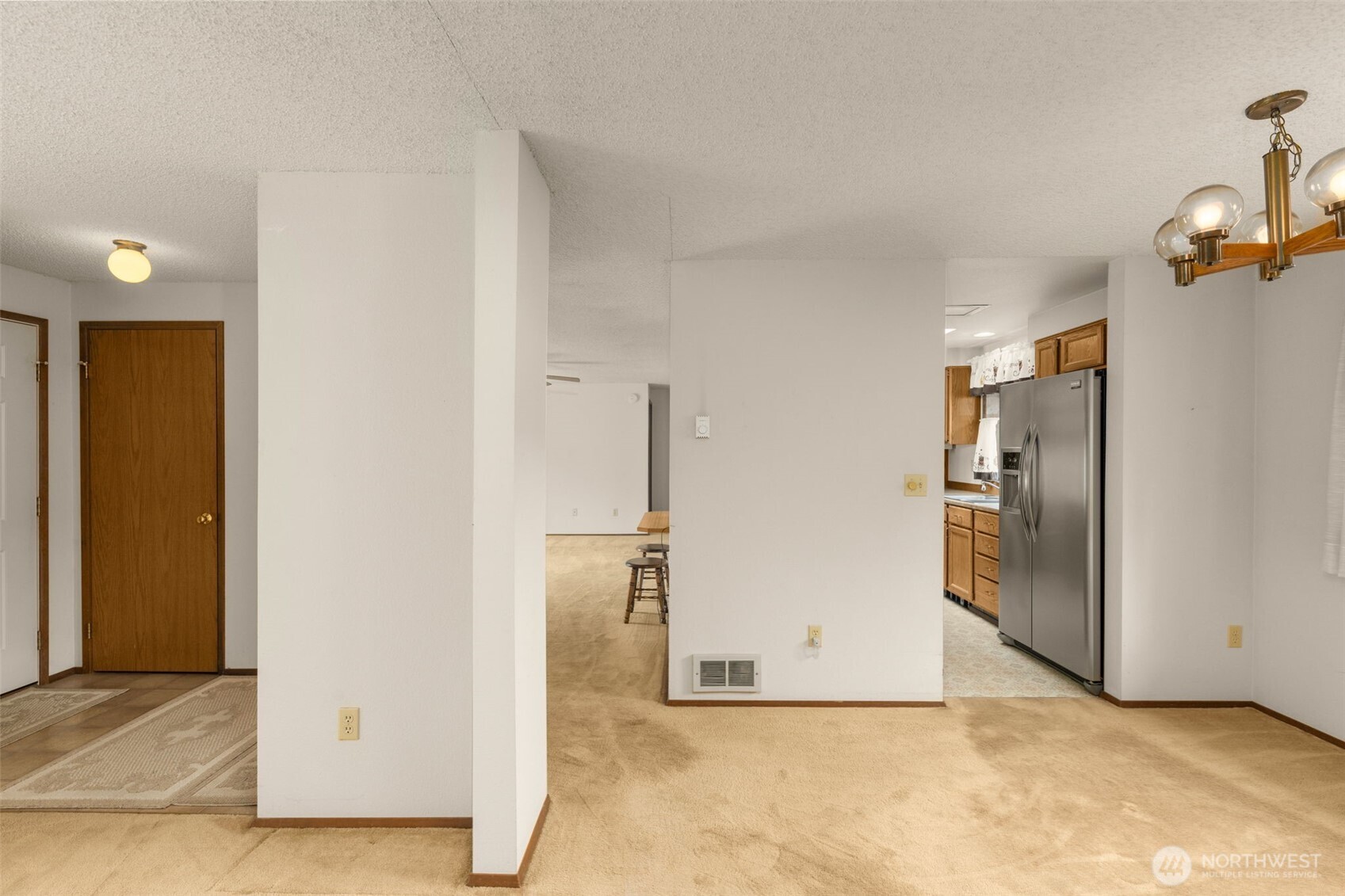 24124 8th Place West Bothell, WA 98021 - Photo 9 of 39 an empty room with a cabinet and mirrors