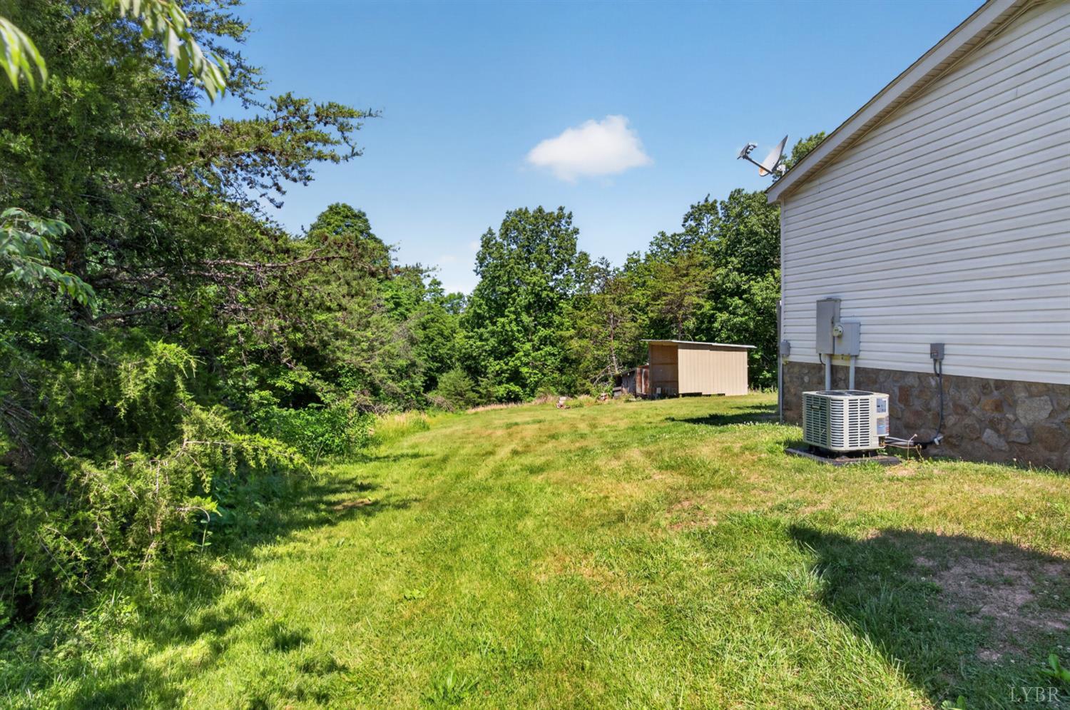 1811 Mohawk Road Gladys, VA 24554 - Photo 30 of 51 a backyard of a house with table and chairs
