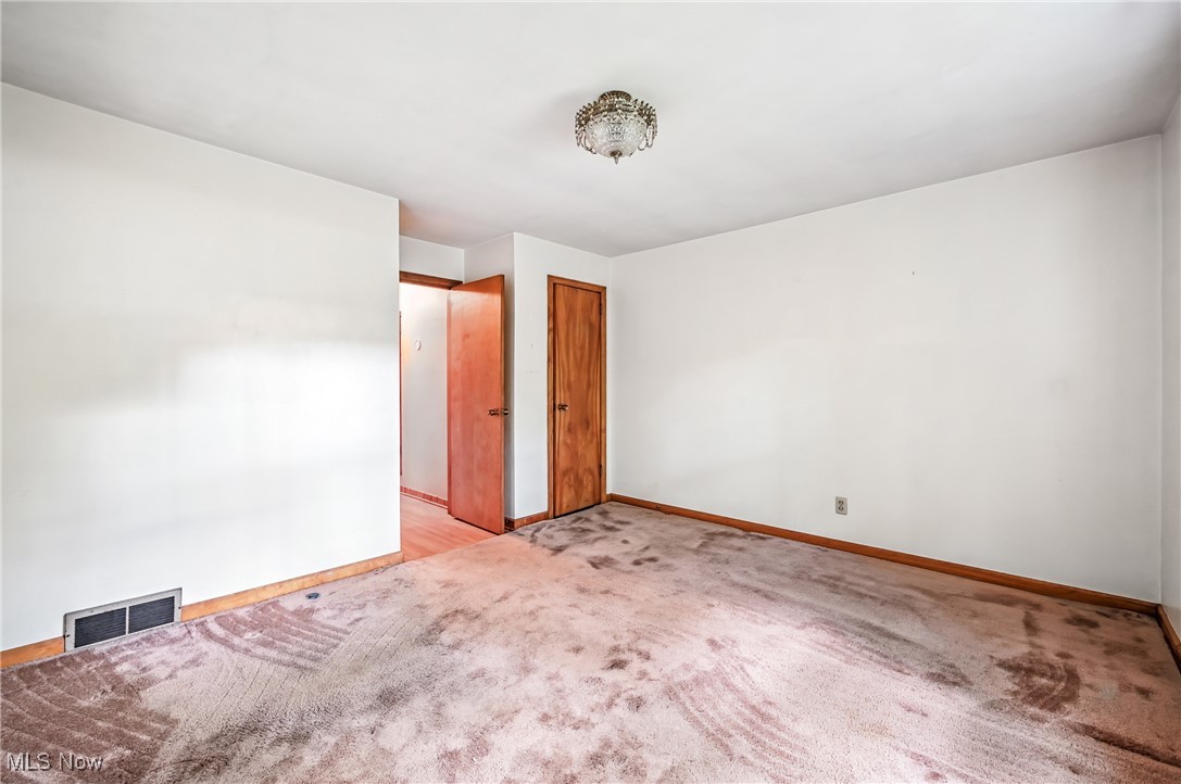 4957 South Raccoon Road Canfield, OH 44406 - Photo 34 of 43 Spare room featuring baseboards and light colored carpet