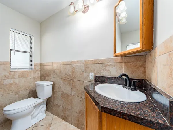 a bathroom with a sink and a toilet