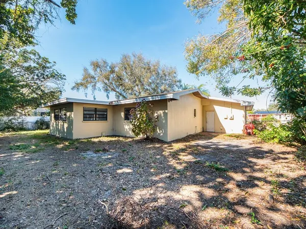 a view of a house with a yard and garage